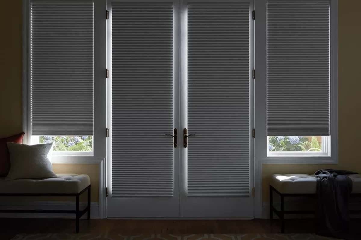 Hunter Douglas Duette ® Cellular shades with blackout features installed on door windows
